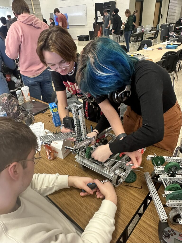 Zeph and Arlo working on their robot, Stephan. 
